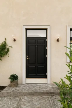 Nuura Miira Outdoor vägglampa, mörk brons - optic clear